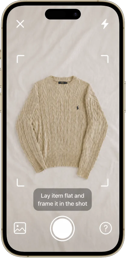 The Vintsnap camera framing a knit sweater laid flat to photograph